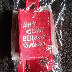 THIS IS A GENUINE LEATHER INHALER HOLDER YOU CAN HOOK ON YOUR PURSE OR JEANS.NWT